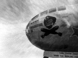 The B-29 bomber "Jolly Roger" of the 58th Bomb Wing, 468th Bomb Group, in the CBI during WWII (info courtesy of shootski).  The nose wheel door says, "Thru these portals pass the worlds fastest..."