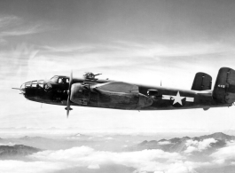 A B-25 bomber, tail #449, of the 491st Bombardment Squadron in flight on a mission.  From the collection of Frank Bates.