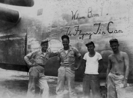 Some men stand before the B-24 "Wham Bam! The Flying Tin Can" in the CBI, which was the aircraft David Firman flew into China, on, flying into Hsinching.