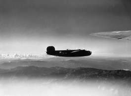 B-24 in the CBI during WWII,  flying over mountains in the southwest China region.
