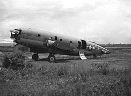 Fuselage of crashed American C-46 transport aircraft in the boneyard at the American airbase in Yunnan, China, during WWII--many of these were used as salvage for spare and repair parts for planes that were still flying.