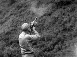 GI shoots Thompson submachine gun in the CBI during WWII.