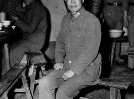 Chinese Lt. General Du Yuming, commander of Nationalist 5th Corps (第五集团军总司令兼昆明防守司令杜聿明), poses for American cameraman on bench, at rally.