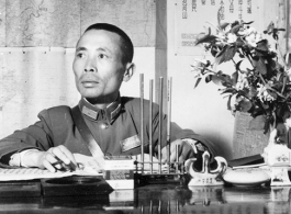  A very emaciated and wary-looking Zheng Tingji (郑庭笈), commander of the 48th Army Division (陆军第四十八师 ), poses at his desk in Yunnan.