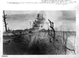 March 5, 1945 bombing by the 341st Bombardment Group, 22nd Bombardment Squadron, on Phu Lang Thuong railway bridge over the Thuong River at Bắc Giang City in French Indochina (Vietnam), during WWII. In northern Vietnam, and along a critical rail route used by the Japanese. In this image the bridge is finally broken, and the two water towers are completely gone.  Coordinates:  21°16'32.69"N 106°11'9.28"E