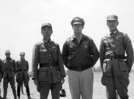 On the left: Zheng Tingji (郑庭笈), commander of the 48th Army Division (陆军第四十八师 ), posing in Yunnan.  Center: Possibly Maj Richard D. Day (李察戴), who was commander of 491st Bombardment Squadron's 19th Liaison Squadron from April 26, 1943, to Sept 1944.  Right: Unknown Chinese officer.  During WWII.