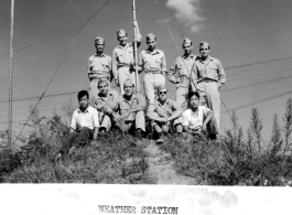 Weather station personnel: Cpl Lacy, Capt Stuart, Pfc Rosene, Sgt Bair, Sgt Wilson, Cpl Sither, Lt Smith, Cpl Lochheed, along with Chinese personnel. Likely in either Ankang or Suichuan, China. During WWII.