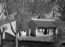 A small building among loess hills in northern China during WWII.
