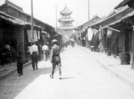 Main street leading to drum or bell tower in the city center at Hanzhong, during WWII.