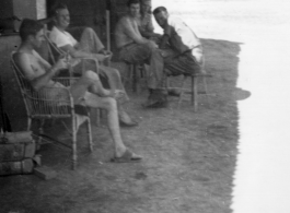 American officers lounging in the cool shade at the officer's quarters at Hanzhong, China, 1945.