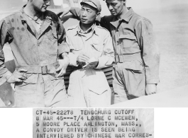 At the Tengchong cutoff: T/4 Lorne C. McEwen, a convoy driver, is seen being interviewed by Chinese war correspondent Mr. Fu Gang-bor, as fellow driver Sgt. G. N. Cumberland looks on.  Yunnan Province on March 4, 1945.  Photo by T/Sgt. Greenberg.  Passed by William E. Whitten.