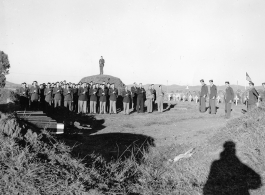 Burials of 1st Lt. John B. Leskie (middle initial corrected), Flight Officer John G. Meuth, 2nd Lt. Lawrence A. Swanson, S/Sgt. Edward Lietener, Sgt. David H. Randolph. All men were members of the 322nd Troop Carrier Squadron. Maj. Gen. Wedemeyer and Maj. Gen. G. X. Cheves were present at the funeral ceremony.  December 16, 1944.  Photo by Pvt. John F. Albert. B-Detachment, 164th Signal Photographic Company, APO 627.
