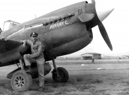Glade C. Burton with his P-40 fighter "Jeffery C." in the CBI during WWII.