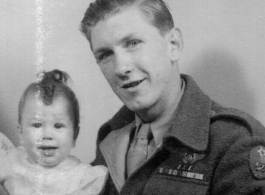 John Jacob Gerber, of the 322nd Troop Carrier Squadron, returned to the US and finally meeting his daughter, born September 1, 1944.