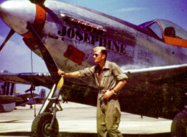 Flyer posing before P-51 "Josephine" in China.  During WWII.