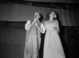 Performers well off the beaten track, providing a break for Burma Road engineers of the 797th Engineer Forestry Company--Pat O'Brien and Jinx Falkenburg perform  During WWII.