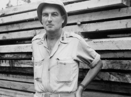 Engineer of the 797th Engineer Forestry Company poses planks in Burma.  During WWII.