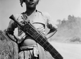 Local people in Burma near the 797th Engineer Forestry Company--a man with a large knife.  During WWII.
