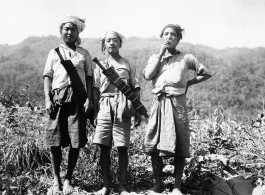 Local people in Burma near the 797th Engineer Forestry Company--three Kachin men with large knives.  During WWII.