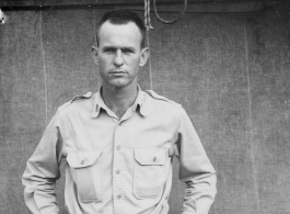 Engineer of the 797th Engineer Forestry Company poses before tent in Burma.  During WWII.