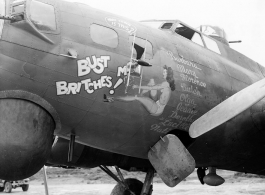 A B-17 bomber retrofitted with radar and new antenna (retrofitted directly over the nose art).  Aircraft in Burma near the 797th Engineer Forestry Company.  During WWII.