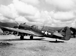 A P-40 fighter at an airstrip in Burma.  Aircraft in Burma near the 797th Engineer Forestry Company.  During WWII.