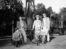 Engineers of the 797th Engineer Forestry Company pose with their catch after a round of huntin' deer in Burma.  During WWII.