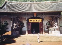 GI taking a picture a the entrance to a chamber (天王宝殿）in the Huating Temple (华亭寺), not far from Kunming, China. During WWII.