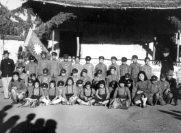 Local school kids pose in courtyard of school in Yunnan province, China, during WWII, at the Songming County Xiaogu Central Elementary School (嵩明县效古中心小学校).