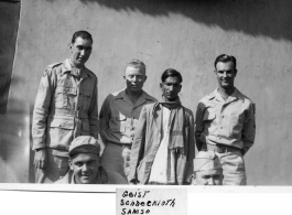 Men of the 2005th Ordnance Maintenance Company,  28th Air Depot Group, possibly in Barrackpore, India posing with Indian staff (left to right):  Henry M. Geist  Edmond R. Schumacher (kneeling)  John F. Schuhart  Samso  Irwin Schneckloth