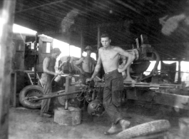 Men of the 2005th Ordnance Maintenance Company,  28th Air Depot Group, working on an anti-aircraft gun in Burma. During WWII.
