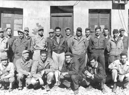 Flyers and staff pose before 373rd Bombardment Squadron offices in China during WWII.