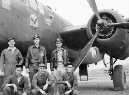Flyers with B-25 Mitchell bomber.  Rear: Bob Selmer, David Hayward, Jim Curran.  Front: George Scearce (center).  22nd Bombardment Squadron, in the CBI.