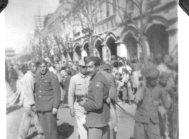 Radar mechanics Charles Klaes and Ashod Janigian among bustling crowds in Kunming, Yunnan, China. During WWII.