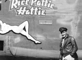Flyer standing with F-7A "Rice Pattie Hattie." 24th Combat Mapping Squadron, 8th Photo Reconnaissance Group, 10th Air Force