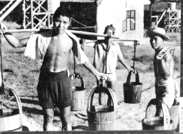 Latrine honey bucket crew at work at Chanyi (Zhanyi), during WWII.