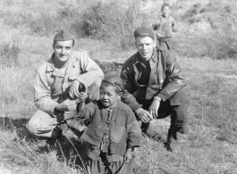 American flyers and Chinese boy at Chanyi (Zhanyi), during WWII.