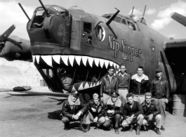 A 373rd Bombardment Squadron (308th Bm Grp) crew poses at the nose of 'Nip Nipper', a B-24D1, serial #42-72837, probably in a revetment at Yangkai, early in 1944.  Image from U. S. Government official sources.