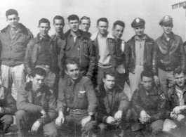 American flyers of the 528th Fighter Squadron pose in a group, probably in China. During WWII.