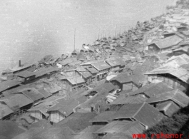 Houses clustered on the Yellow River during WWII, most likely in or near Lanzhou. Note the numerous boats tied there too.