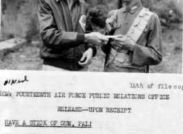 Staff Sergeant Richard W. O'neal shares stick of gum with Chinese soldier. Sgt. O'neal, assigned to CACW, was an aerial photographer who had served in India and China.