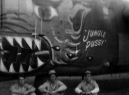 American soldiers sit below the B-24 bomber "Jungle Pussy" in the CBI during WWII.