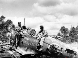 Robert Riese (right) and another GI check out derelict Japanese fighter plane at Liuzhou during WWII, in 1945.