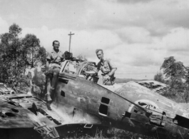 Robert Riese (right) and another GI check out derelict Japanese fighter plane at Liuzhou during WWII, in 1945.