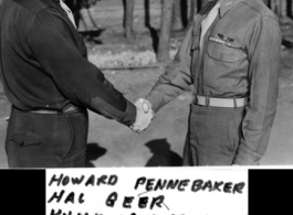 Capt. Howard Pennebaker and Hal Geer, both members of the 16th Combat Camera Unit, shake hands in Kunming, China, on January 8, 1945.