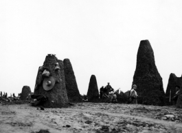 Excavation before construction at an American base in China during WWII.  The pillars are limestone, left after the soft soil had been dug away.  Likely to be in Guangxi, either Liuzhou or Guilin.   From the collection of Hal Geer.