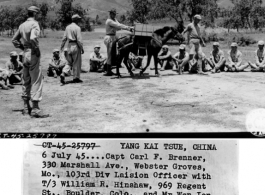 6 July 1954.... Capt Carl F. Benner, 330 Marshall Ave., Webster Groves, MO., 103rd Division Liaison Officer with T/3 William R. Hinshaw, 969 Regent St., Boulder, CO., and Mr. Wen Jen, Chinese interpreter of the 8th Chinese Army instructs a class of Chinese students in correct method of using a pack carrier and pack saddle.
