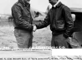 Colonel T. Alan Bennett CO of "Al's Assassins", as his pilots have dubbed his fighter group, congratulates his Vice Commander, Major C. H. Yuan who escaped from the Japanese. 