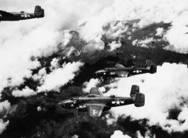 Three aircraft of the 491st Bm Sq, including  B-25C, 42-64650,  and B-25D, 41-29930, fly in formation somewhere over the Naga Hills in Burma in 1943.