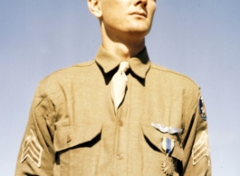 An American flyer in China poses with an award pinned to his chest. During WWII.